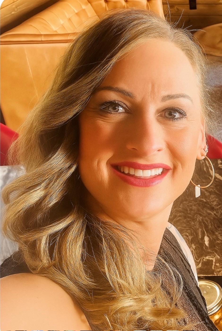 Ginger the owner, standing behind the bar.